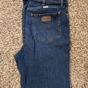 Wrangler Westbound Blue Boot Cut Jeans with Worn Look and Leather Patch
